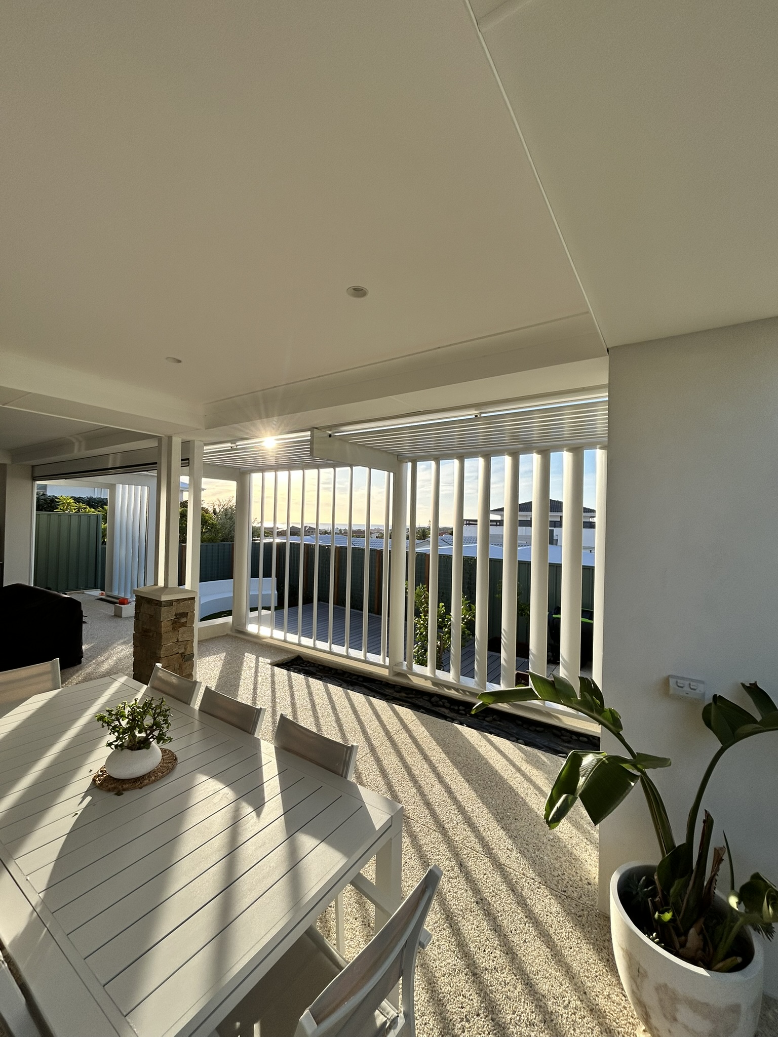 Completed white pergola and vertical screen