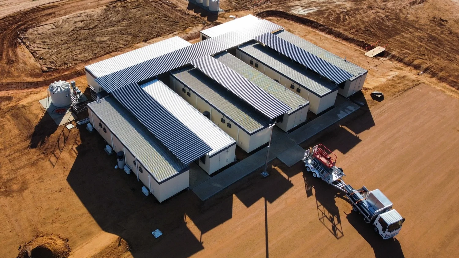 Completed steel-roofed structures viewed from above