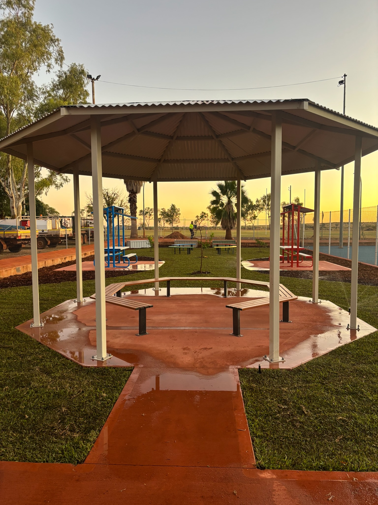 White-roofed community shade shelter with seating