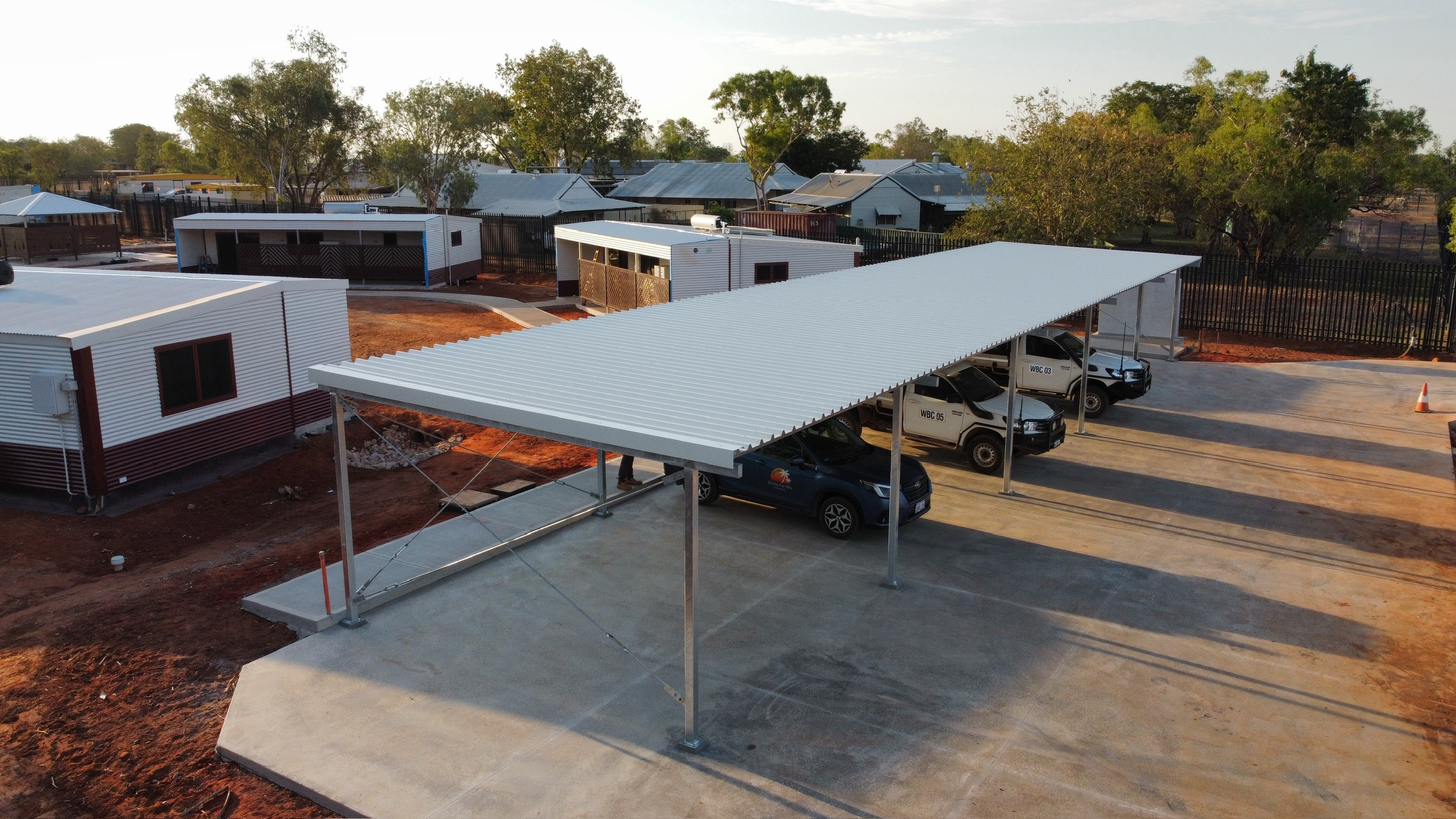 Large steel-roofed vehicle canopy viewed from above